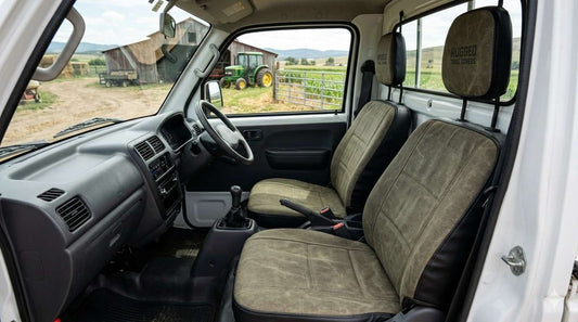 Clean and durable Kei truck seat covers installed in a farm truck interior, showing heavy-duty, water-resistant, and fitted design